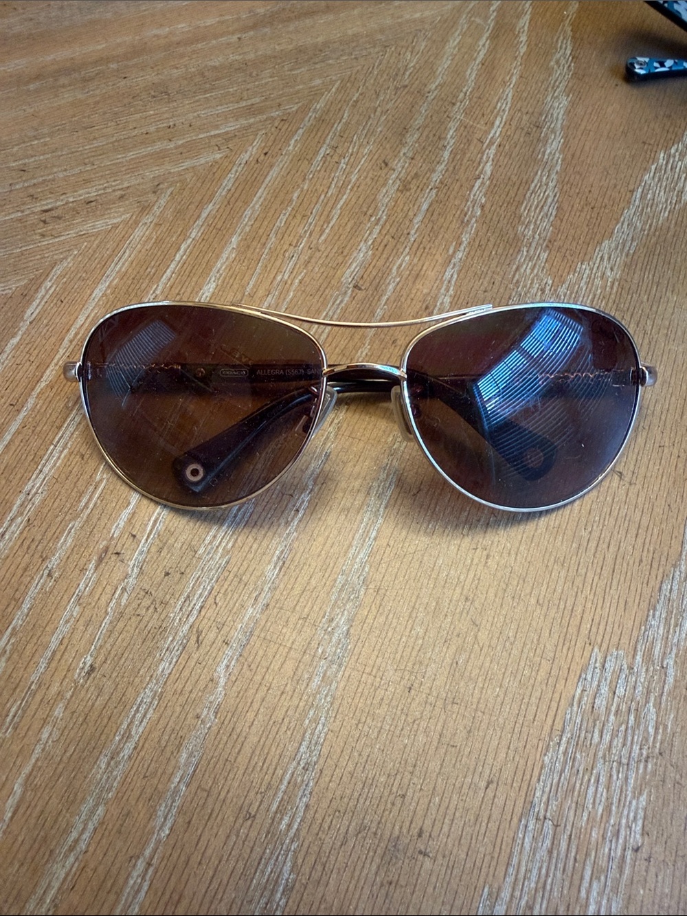 Coach ALLEGRA Gold Frame Sand is the color Aviator Sunglasses with Brown Lenses